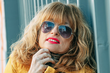 portrait of mature or senior adult woman on the streetの写真素材