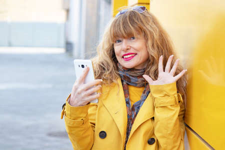 attractive woman talking on mobile phone in the street
