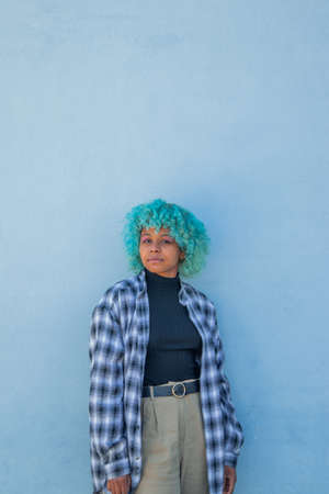 young black afro american woman in casual style on the street wallの写真素材
