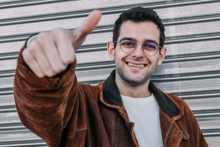 man smiling with okay and approval signの写真素材