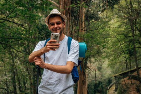 young traveler with mobile phone taking photos