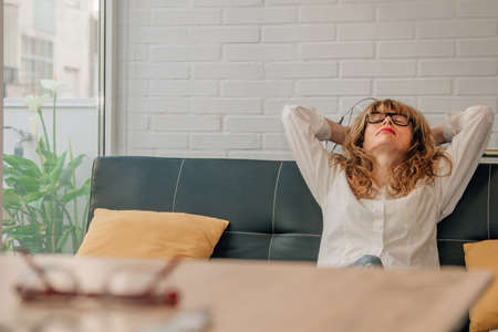woman resting in the living roomの写真素材