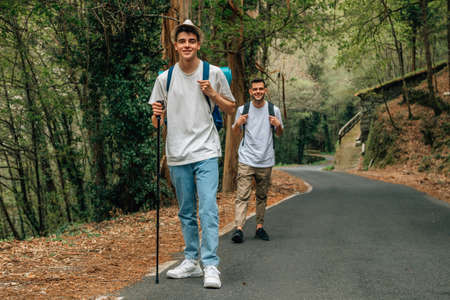 young people on a trip or excursion practicing hiking or pilgrimageの写真素材