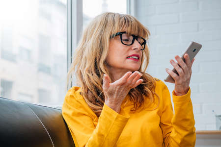 woman talking on the phone with the hands-free