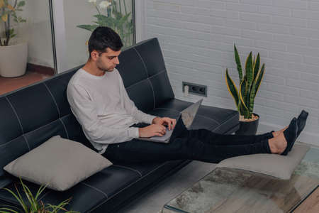 freelance at home with computer workingの写真素材