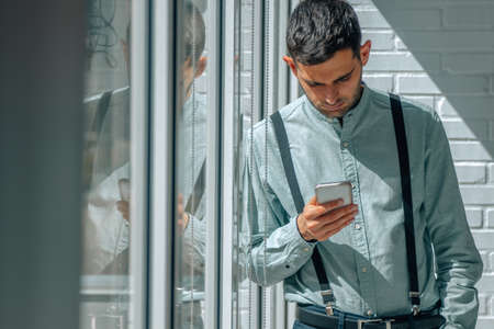 businessman with mobile phone in office