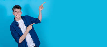 isolated student pointing to spaceの写真素材