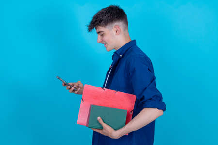 student with mobile phone isolated on blue background