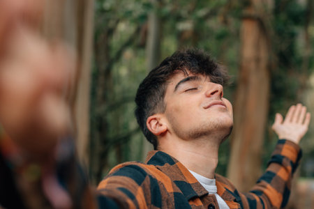 teen boy relaxed outdoors breathingの写真素材