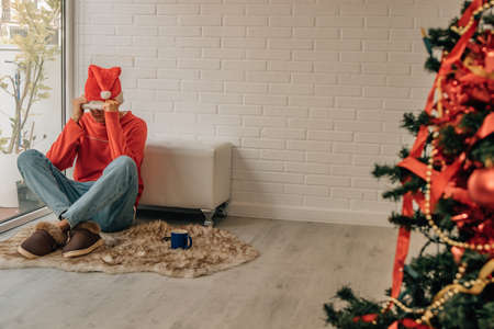 angry young man at home at christmasの写真素材