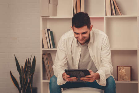 man at home with table or computer