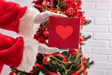 santa claus hands with christmas giftsの写真素材