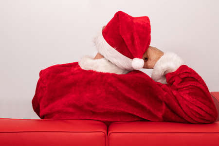 santa claus on his back restingの写真素材