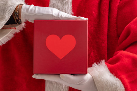 santa claus hand with christmas giftの写真素材