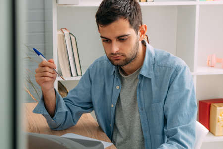 man at home with computer