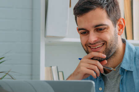 man at home with computer