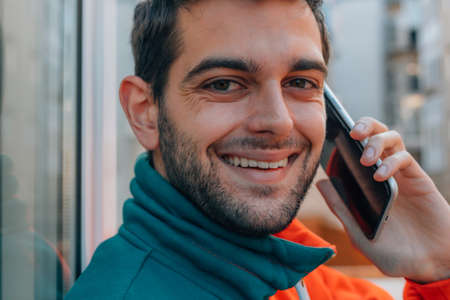 macro portrait of man with mobile phoneの写真素材