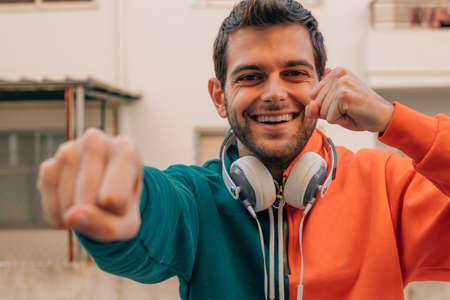 young man smiling excited celebrating successの写真素材
