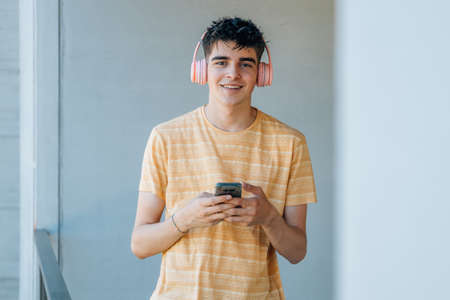 teenager or student with headphones and mobile phone