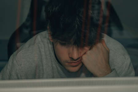young man in front of computer screen