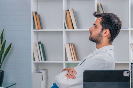 doctor in hospital relaxed at desk
