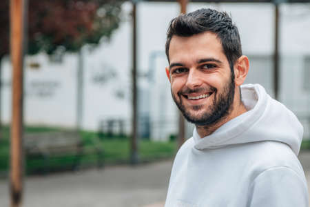 portrait of young bearded man on the streetの写真素材