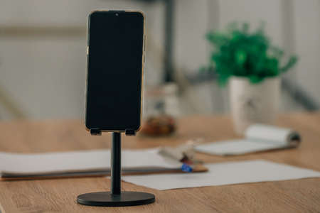 mobile phone or smartphone in the holderの写真素材