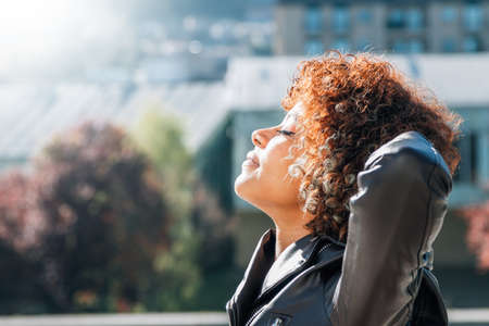 girl breathing relaxed in the street outdoors