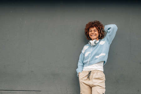 african american girl on the street with a wall in the background, no filtersの写真素材