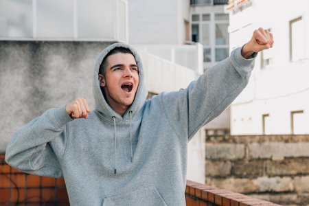 excited teen millennial celebrating successの写真素材