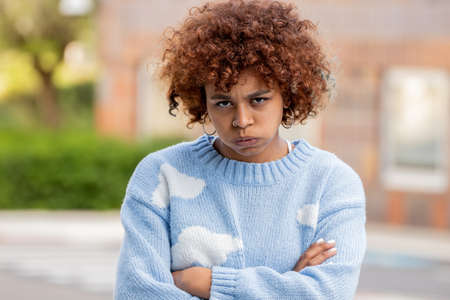 african american girl on the street with mobile phoneの写真素材