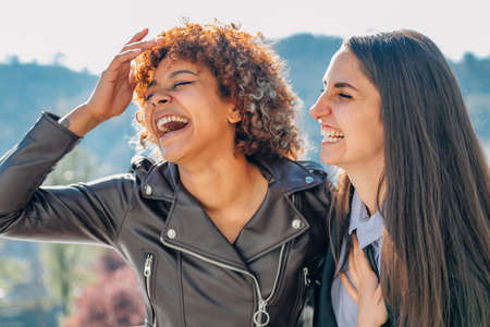 girls smiling happy on the streetの写真素材