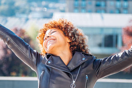 portrait happy african american girl smiling in the street relaxedの写真素材