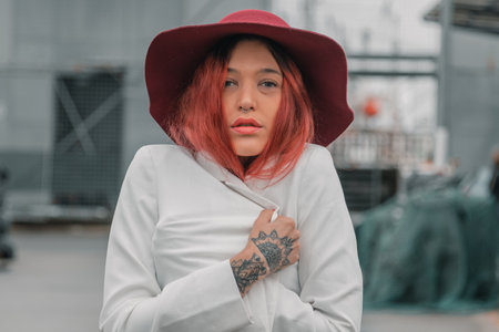 funky hipster with tattoos and hat