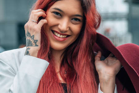 portrait of red-haired girl with hatの写真素材