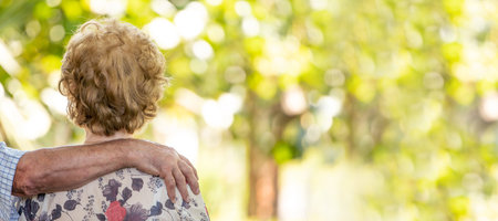 senior older couple cuddling outdoorsの写真素材