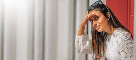 portrait of latin girl looking on the street with copy