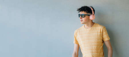 isolated teen boy with headphonesの写真素材