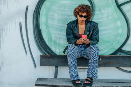 urban girl with mobile phone in the streetの写真素材