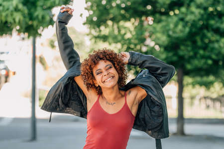 african american girl euphoric with happiness in summer outdoorsの写真素材