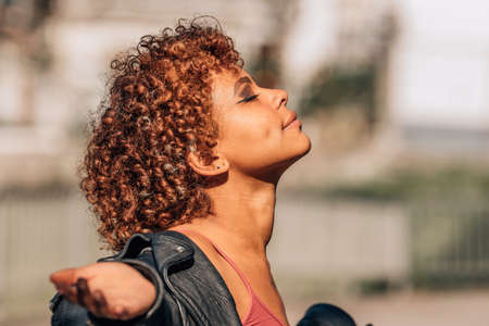 african american girl breathing relaxed outdoors