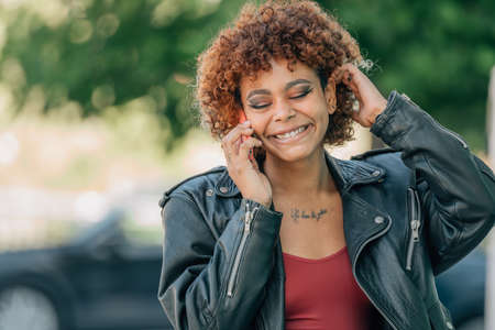 young girl on the street talking on mobile phone