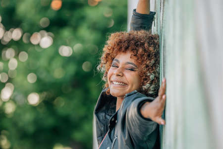girl smiling happy in the street outdoorsの写真素材