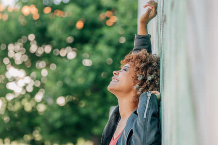 african american girl smiling happy on street wallの写真素材