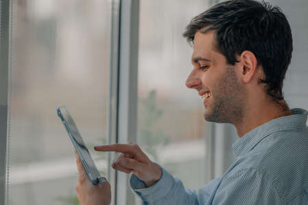 freelance man at home or office with digital tablet