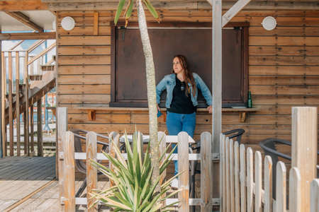 woman at the beach bar in summerの写真素材