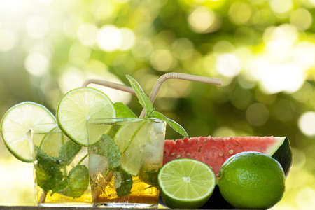 glass of mojito with lime in summer outdoorsの写真素材