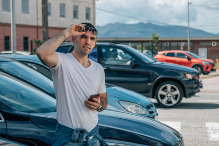 driver with mobile phone and carsの写真素材