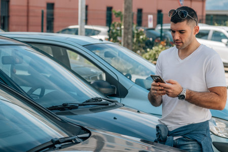 man buying used or second-hand car at dealershipの写真素材
