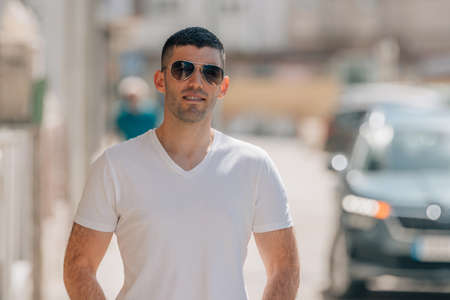 portrait of young man on the street outdoorsの写真素材